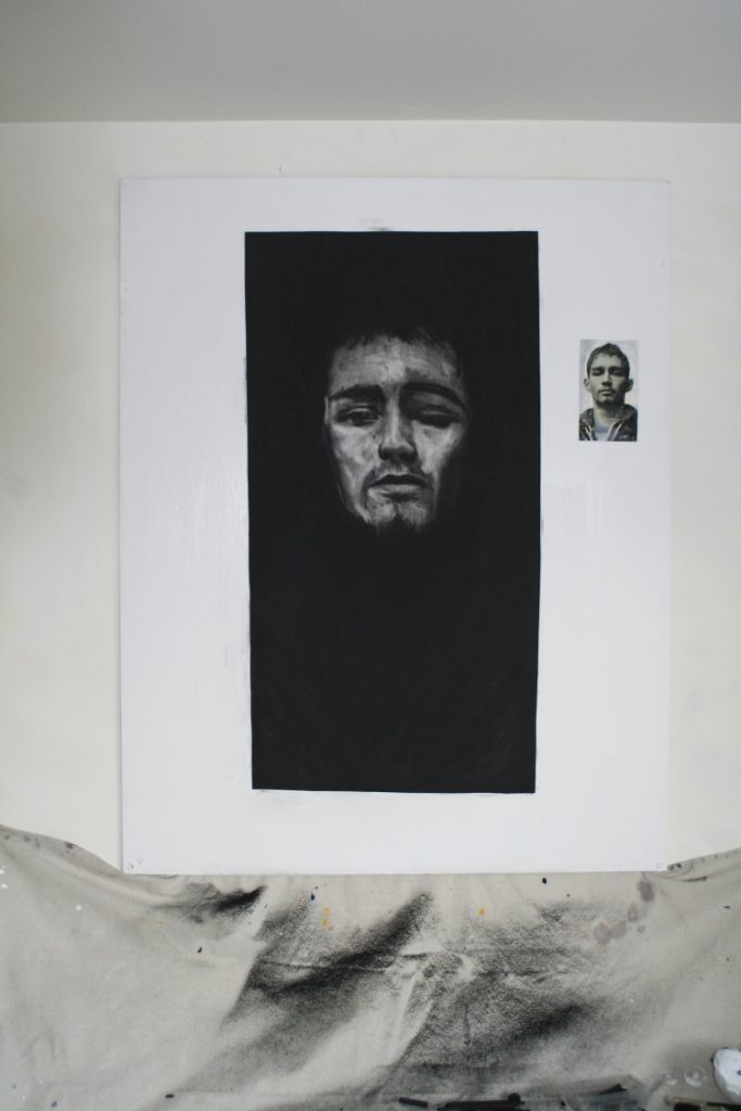 Darren head - The head of Darren emerges as Ronan Goti rubs the compressed charcoal from the paper to reveal him
